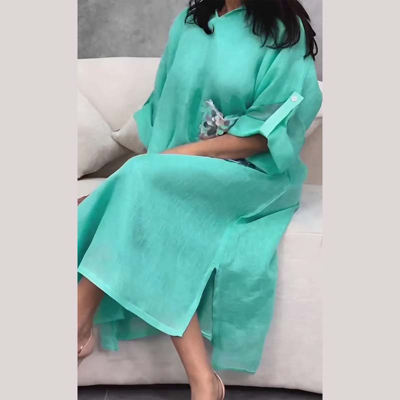 Maxi abito con cappuccio in paillettes a squame di pesce