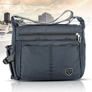 Borsa a tracolla leggera e impermeabile con tasche multiple
